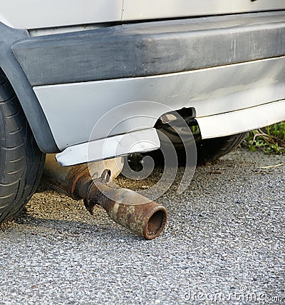 Broken muffler Stock Photo