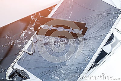 Broken phone screen, blade cuts smartphone screen Stock Photo