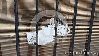 Broken polycarbonate fence. Hole in polycarbonate railing. Stock Photo