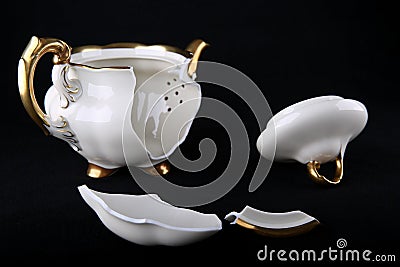 Broken porcelain teapot Stock Photo