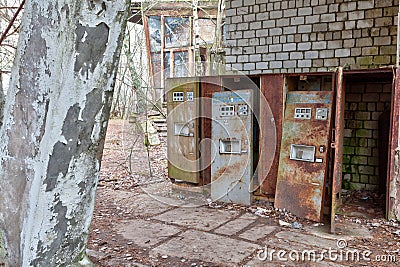 Broken refreshments drinks machines in overgrown ghost city Pripyat. Stock Photo