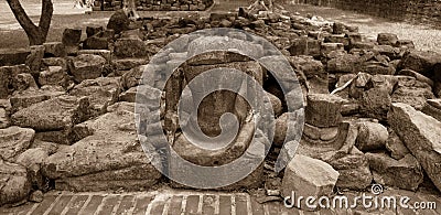 The broken remains of an ancient 20th-century Buddha statue in vintage tone Stock Photo