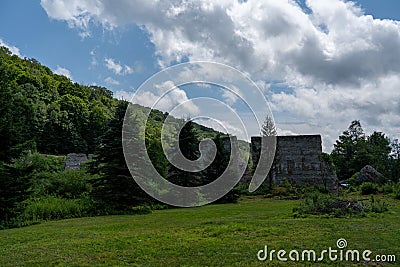 Broken remains of the Austin Dam failure in Austin, Pennsylvania under the cloudy sky Stock Photo