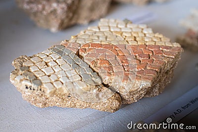 Broken remains of excavated Mosaic floor pieces from a Roman Villa in West Sussex, England Stock Photo