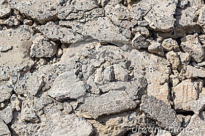 Broken Road crack Texture. After Construction drilled surface with jackhammer. Concrete broken from excavator drilling. The road w Stock Photo