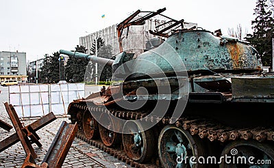 A broken Russian tank and anti-tank hedgehogs. Kremenchuk, Ukraine. Remains of military equipment Editorial Stock Photo