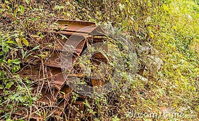 Broken, rusted bulldozer tracks Stock Photo