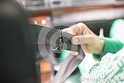 Broken seat belt on the car in old vintage car Stock Photo