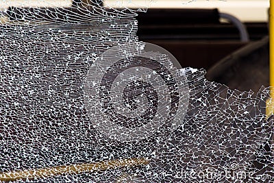 Broken side window in the vehicle. After the glass was broken, it cracked and it looked like a mesh. Stock Photo