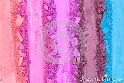 Broken and smashed make-up eyeshadow pallete, lay of brush strokes, close-up for background, top view Stock Photo