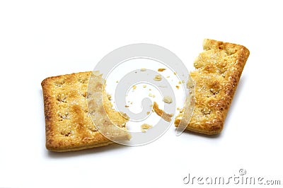 Broken square crackers biscuits isolated on white background. Stock Photo