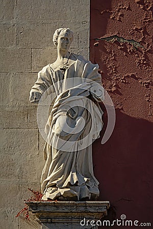 Broken statue of an apostle without arms Editorial Stock Photo