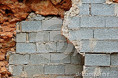 Broken stone and cinder block walls Stock Photo