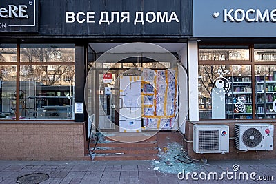 Broken store windows. Vandalized stores in Almaty. Consequences of demonstrations turned into riots in Almaty Editorial Stock Photo