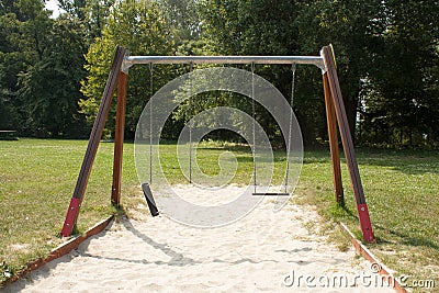 Broken swing Stock Photo