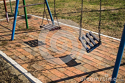 Broken swing Stock Photo