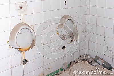 Broken toilets inside a abandoned building. Dirty toilet Stock Photo