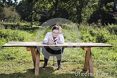 Broken unemployed businesswoman looking through the cell Stock Photo