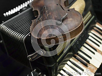 Broken violin and harmonica Stock Photo