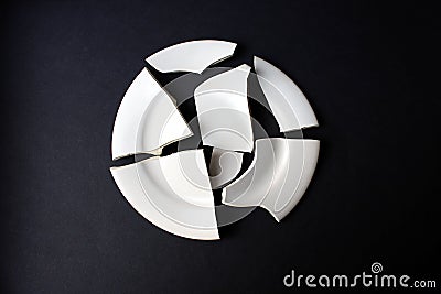 A broken white porcelain dish that does not stick together Stock Photo