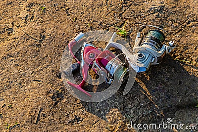 Broken fishing tackles discarded by the lake Stock Photo