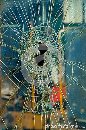 Cracked Broken Glass with Hole Stock Photo