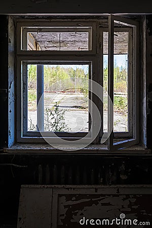 Broken window in abandoned house Stock Photo