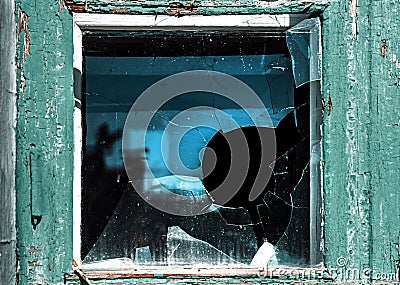 Broken window. Cracked glass with hole. Vandalism, destruction and accident concept Stock Photo