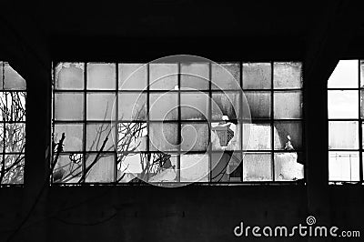 Broken windows and concrete wall Stock Photo