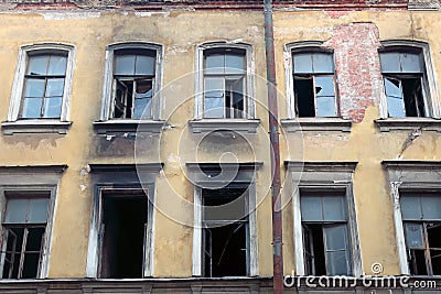 Broken windows at home after a fire Stock Photo