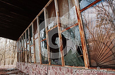 Broken windows at rusty frame on Chernobyl disaster, Ukraine. Stock Photo