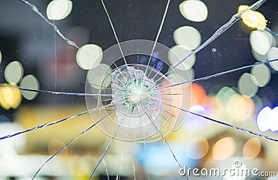 Broken windshield glass on a bokeh background Stock Photo