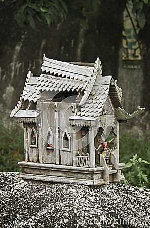 Broken wooden spirit house in thailand Stock Photo