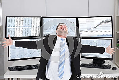 Broker Laughing While Standing With Arms Outstretched Stock Photo