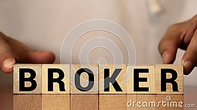 broker word written on wood block. broker text on wooden table for your desing, concept Stock Photo