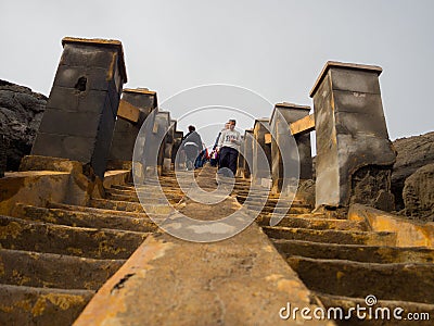 BROMO, INDONESIA - JULY 12, 2O17 : Tourists walking dowstairs and upstairs to the top of Mount Bromo, the active mount Editorial Stock Photo