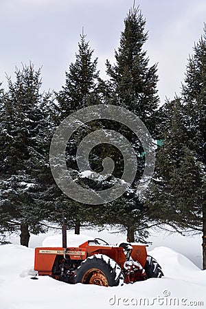 Tractor during snow storm in rural Bromont Editorial Stock Photo