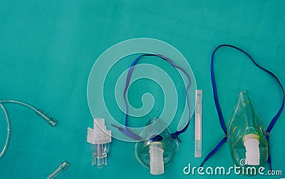 Bronchodilator drug and kid and adult nabulizer mask on green background in asthma treatment care concept with copy space Stock Photo