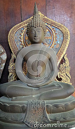 Bronz Buddha image and wheel of Dhama Stock Photo