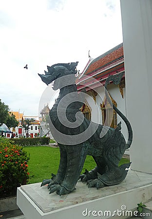 Bronz singha guarding the Marble temple entrance Stock Photo