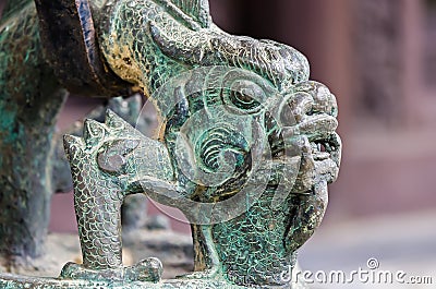 Bronze ancient dragon head in buddha temple Stock Photo