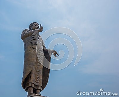 Bronze buddha statue standing Stock Photo