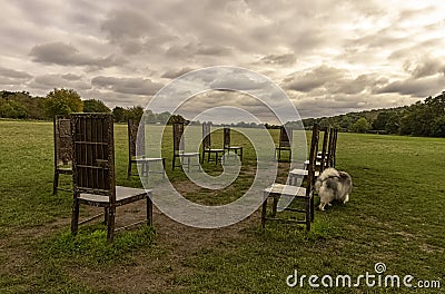 12 bronze chairs - Jurors artwork by Hew Locke in Runnymede, Surrey, UK Stock Photo