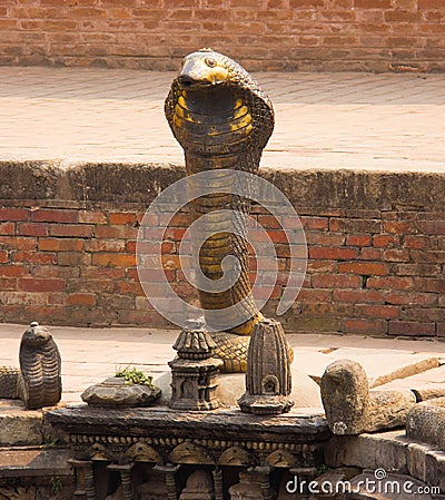 A Bronze Cobra at at Local Bath in Kathmandu Stock Photo