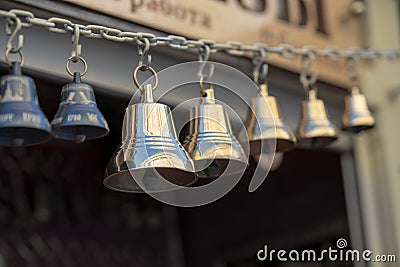 Bronze and copper made small bells locked Stock Photo