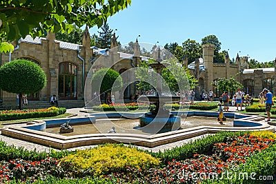 Bronze fountain 'Frogs' against Narzan Gallery. Fountain was built in 1895. Editorial Stock Photo