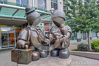 The bronze Immigrant Family sculpture by Tom Otterness on Yonge Street. Editorial Stock Photo