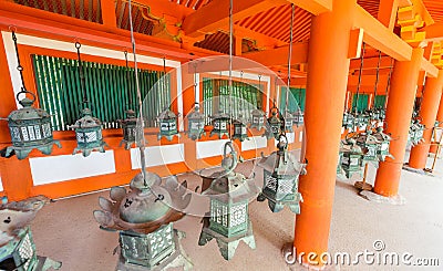 Bronze lanterns hanging in the grounds of Kasuga-Taisha Shrine, Stock Photo