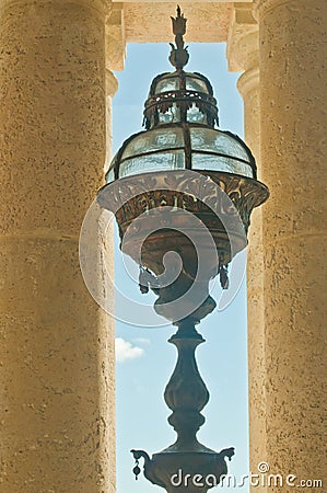 Bronze light fixture hanging in a concrete poetical Stock Photo