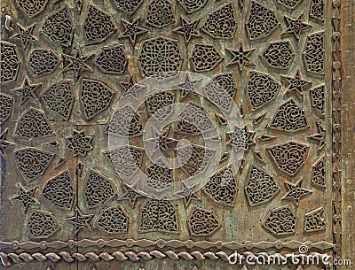 Bronze-plate ornaments of an aged door Stock Photo